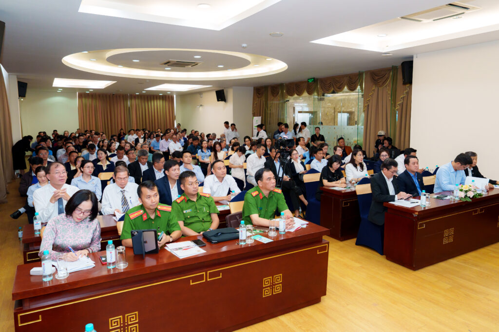 A large, seated audience of property managers and officials attending the HCMO technical training gathering.